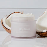 Coconut Sugar Body Scrub Next to Coconuts